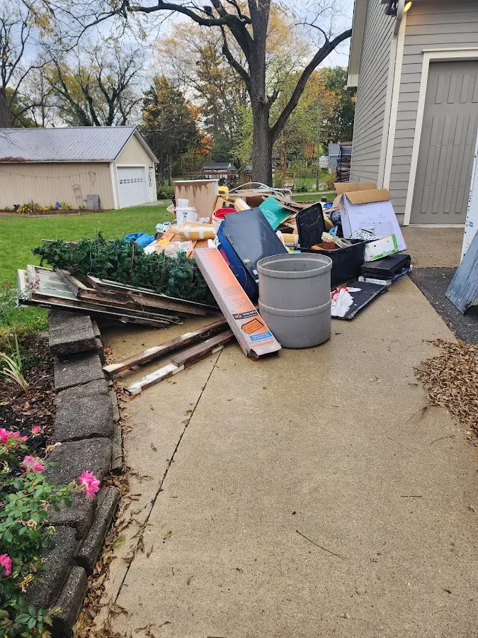Dumpster being loaded with debris for 3 Yard Dumpster Rental in Fairmount